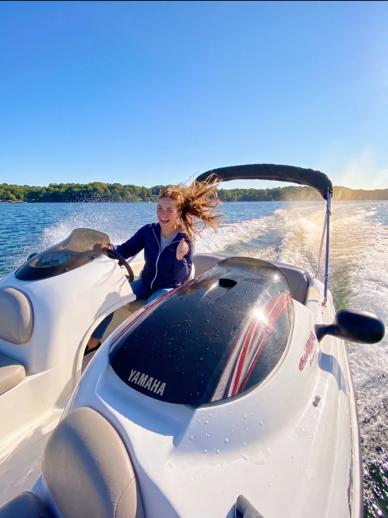 Woman driving a Yamaha jet boat in Oyster Bay harbor